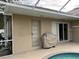 Covered patio area with access to the pool and backyard at 2213 Towering Oaks Cir, Seffner, FL 33584