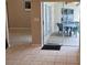 Outdoor patio features a dining table with a view of the screened pool area at 2213 Towering Oaks Cir, Seffner, FL 33584