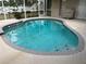 Inviting swimming pool with decorative tile and plenty of space for lounging at 2213 Towering Oaks Cir, Seffner, FL 33584