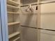 Organized walk-in closet with shelving and hanging rods offers ample storage space at 2213 Towering Oaks Cir, Seffner, FL 33584