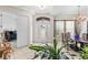 Elegant foyer with tile flooring, a decorative front door, and dining area at 2908 122Nd Pl E, Parrish, FL 34219