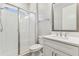 Clean and modern bathroom featuring a glass-enclosed shower and bright lighting at 29895 Picana Ln, Wesley Chapel, FL 33543