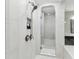 Elegant walk-in shower with glass door and rainfall shower head in primary bathroom at 29895 Picana Ln, Wesley Chapel, FL 33543
