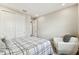 Cozy bedroom offering a large closet and chair at 29895 Picana Ln, Wesley Chapel, FL 33543