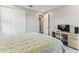 Cozy bedroom with neutral colors, desk area, and closet space at 29895 Picana Ln, Wesley Chapel, FL 33543