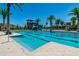 View of the 6ft deep community pool featuring a water slide, lap lanes, and surrounding lounge areas at 29895 Picana Ln, Wesley Chapel, FL 33543