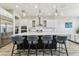 Modern kitchen features a large island with seating and stainless steel appliances at 29895 Picana Ln, Wesley Chapel, FL 33543