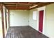 Outdoor back porch, wooden flooring, providing an outdoor area for laundry and more at 3412 N 54Th St, Tampa, FL 33619