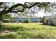Large backyard with a shed and wooden fence at 3412 N 54Th St, Tampa, FL 33619