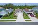 Charming single-Gathering home featuring a well-manicured lawn, landscaped garden beds, and a two-car garage at 3603 Woodmont Dr, Parrish, FL 34219