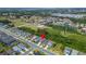 Drone point of view showcasing neighborhood, ponds, and location marked with red pin at 3603 Woodmont Dr, Parrish, FL 34219