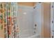 Clean bathroom featuring a tub with shower and decorative starfish wall hangings at 3603 Woodmont Dr, Parrish, FL 34219
