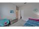 Bright bedroom featuring charming decor, plush carpeting, and ample natural light at 3603 Woodmont Dr, Parrish, FL 34219