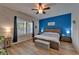 Spacious bedroom features an accent wall, wood floors, and bright natural light at 3603 Woodmont Dr, Parrish, FL 34219