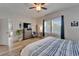 Nautical-themed bedroom boasts natural light, wood floors, and ceiling fan at 3603 Woodmont Dr, Parrish, FL 34219