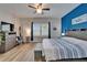 Bright, nautical-themed bedroom with modern accents and natural light at 3603 Woodmont Dr, Parrish, FL 34219