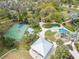 A top-down view of a park featuring a basketball court, playground, and covered picnic area at 3603 Woodmont Dr, Parrish, FL 34219