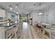 Open-concept dining area with hardwood floors and plenty of natural light at 3603 Woodmont Dr, Parrish, FL 34219