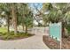 Dog park featuring a fenced-in area with lush landscaping and clear signage for rules and regulations at 3603 Woodmont Dr, Parrish, FL 34219
