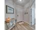 Welcoming entryway boasting wood flooring, light walls, and stylish decor creating a delightful atmosphere at 3603 Woodmont Dr, Parrish, FL 34219