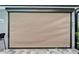 Exterior home window with a roll down shade and view of outdoor patio area at 3603 Woodmont Dr, Parrish, FL 34219