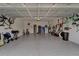 Spacious garage with epoxy floor and storage racks creating a clutter-free space at 3603 Woodmont Dr, Parrish, FL 34219