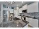 Granite counters highlight this kitchen's island with sink and stainless appliances at 3603 Woodmont Dr, Parrish, FL 34219