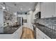 Updated kitchen features granite countertops, stainless appliances and ample cabinet space at 3603 Woodmont Dr, Parrish, FL 34219