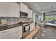 Well-equipped kitchen featuring stainless steel appliances and a stylish backsplash at 3603 Woodmont Dr, Parrish, FL 34219
