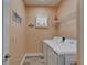 Functional laundry room with washer, dryer, and shelving for storage at 3603 Woodmont Dr, Parrish, FL 34219