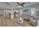 Open-concept layout seamlessly connects the kitchen, living area, and dining space at 3603 Woodmont Dr, Parrish, FL 34219
