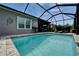 View of backyard pool area with outdoor seating, bar stools and lanai access at 3603 Woodmont Dr, Parrish, FL 34219