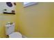 A compact powder room is decorated with floral wall decorations at 3603 Woodmont Dr, Parrish, FL 34219