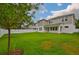 Spacious backyard featuring a well-maintained lawn and privacy fence at 3614 W Platt St, Tampa, FL 33609