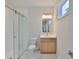 Modern bathroom with glass shower, vanity, and a beautiful mirror at 3614 W Platt St, Tampa, FL 33609