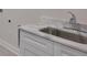 Modern bathroom vanity with a marble countertop, undermount sink, and shaker-style cabinets at 3614 W Platt St, Tampa, FL 33609