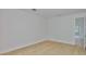 A light and airy bedroom with hardwood floors, offering a serene and comfortable living space at 3614 W Platt St, Tampa, FL 33609