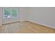 Bright bedroom with hardwood floors and large window bringing the outdoors in at 3614 W Platt St, Tampa, FL 33609