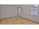 Cozy bedroom with light hardwood floors and natural light at 3614 W Platt St, Tampa, FL 33609