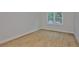 Cozy bedroom with natural light from the window and wood flooring at 3614 W Platt St, Tampa, FL 33609