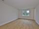 Bright bedroom with beautiful hardwood floors and large window bringing the outdoors in at 3614 W Platt St, Tampa, FL 33609