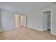 Bedroom featuring two doors, hardwood floors, and natural light at 3614 W Platt St, Tampa, FL 33609