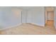 Spacious bedroom with hardwood floors and multiple doorways, showcasing the home's layout at 3614 W Platt St, Tampa, FL 33609