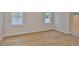 Light-filled bedroom with wood flooring and neutral walls at 3614 W Platt St, Tampa, FL 33609