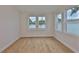 Bright bedroom with hardwood floors and natural light streaming through the windows at 3614 W Platt St, Tampa, FL 33609