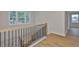 Hallway with hardwood floors and staircase at 3614 W Platt St, Tampa, FL 33609