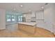 Modern kitchen with stainless steel appliances, recessed lighting, and hardwood flooring at 3614 W Platt St, Tampa, FL 33609