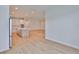 Spacious living room and kitchen area with stainless steel appliances, hardwood floors, and recessed lighting at 3614 W Platt St, Tampa, FL 33609