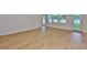 Spacious living room with light hardwood flooring, white trim, and many windows allowing for natural light at 3614 W Platt St, Tampa, FL 33609