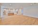 Open floor plan featuring hardwood floors and a view into the kitchen at 3614 W Platt St, Tampa, FL 33609